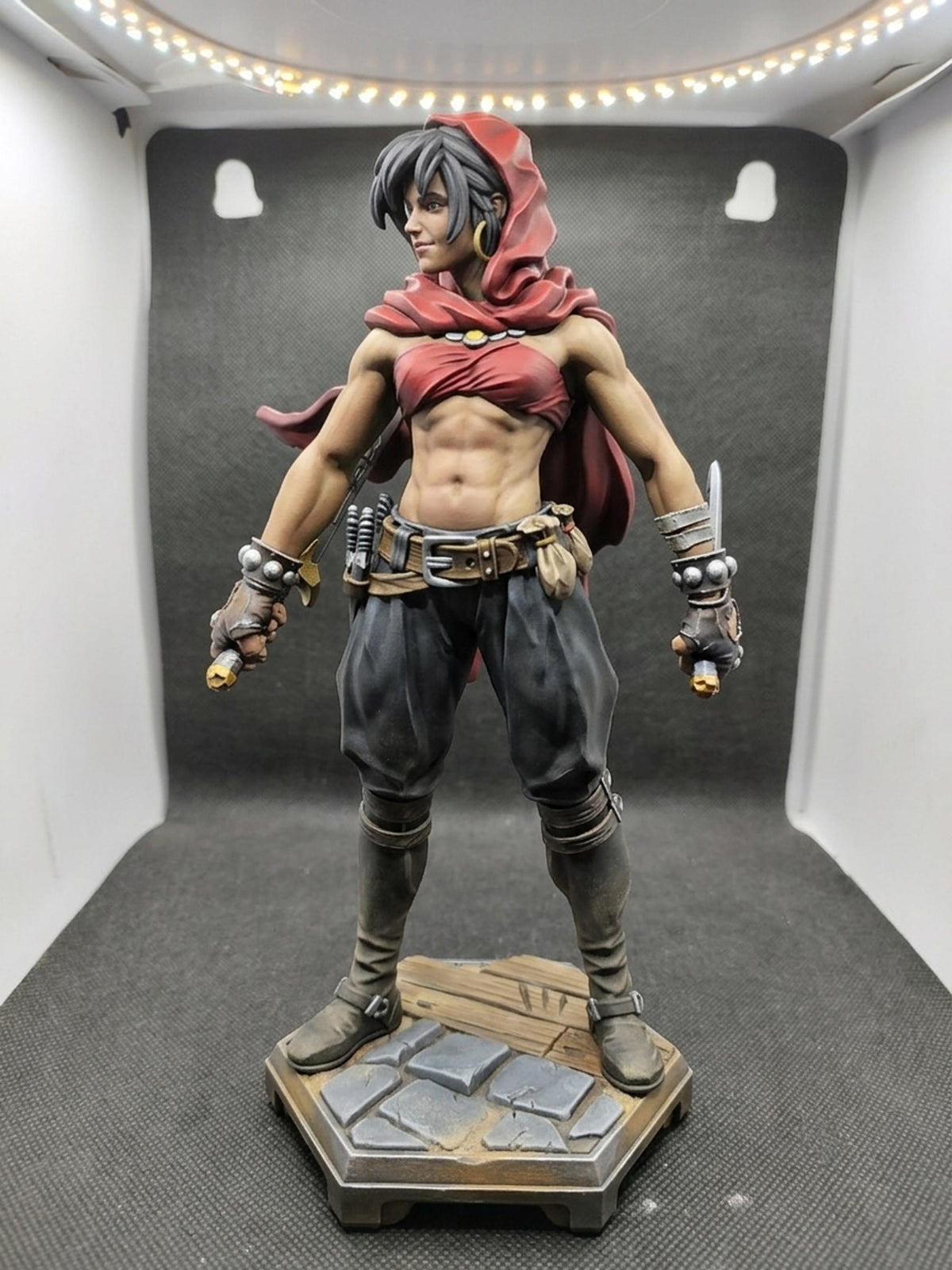 Thief of Mystara fantasy rogue figurine, red hood, stone base