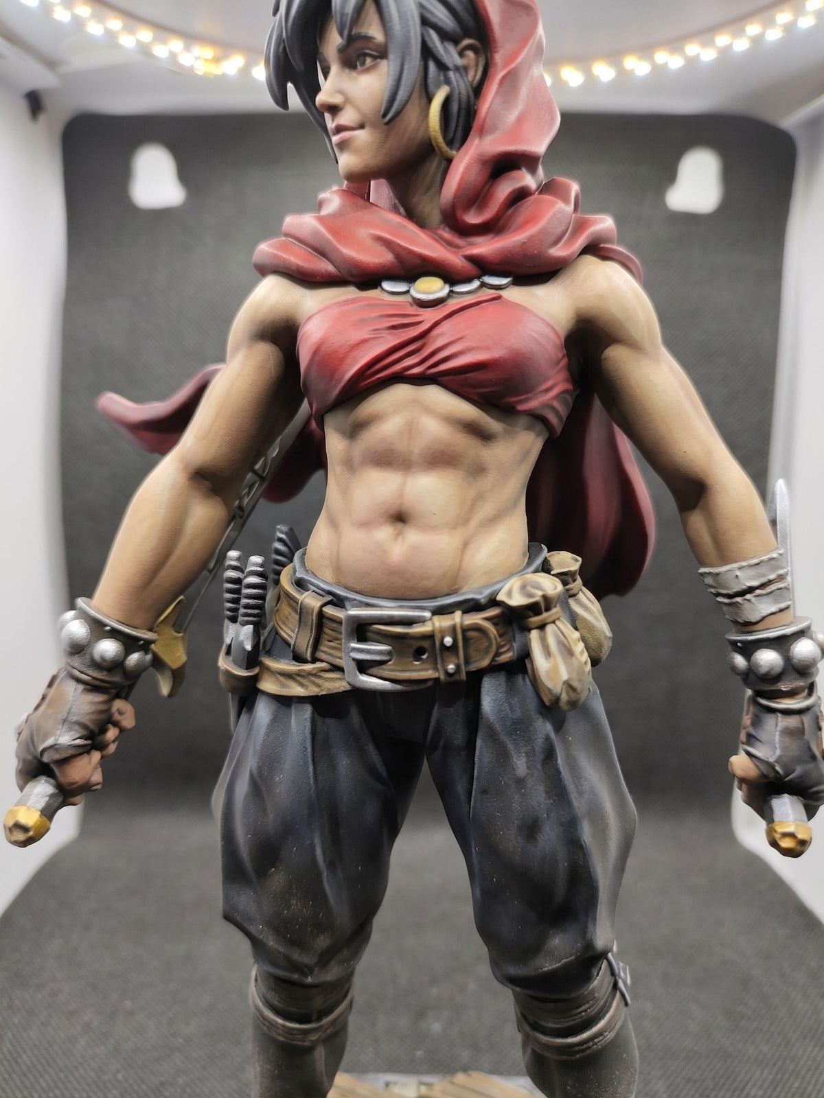 Thief of Mystara fantasy rogue figurine, red hood, stone base